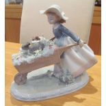 A Lladro figure A Barrow of Fun No 5460 modelled by Regino Torrijos (two flowers a/f)
