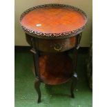 A circular French style two tier table with gilt gallery to top floral marquetry design