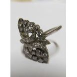 A pretty diamond ring in non precious metal mount spray of flowers Size L