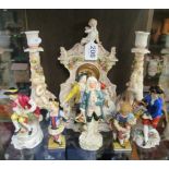 A porcelain clock (a/f), two candlesticks (both restored), five figures (a/f) and Naples figure