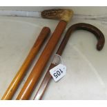 A horn handle walking stick with silver ferrule and another