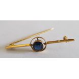 A yellow metal and sapphire bar brooch