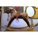 A rocking horse in brown fabric