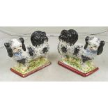 A pair of Victorian standing Pekingese dogs (one crack to base)