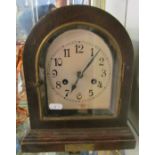 An oak arch top mantel clock silvered dial with plaque 1936