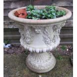 A stoneware garden urn