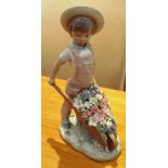 A Lladro figure Wheelbarrow with flowers No1283 retired 1992 designer Francisco Catala (one flower