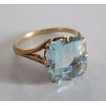 A gold coloured ring set aquamarine style stone size L/N