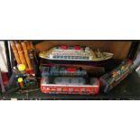 A model tin plate boat, three trains and other vintage toys