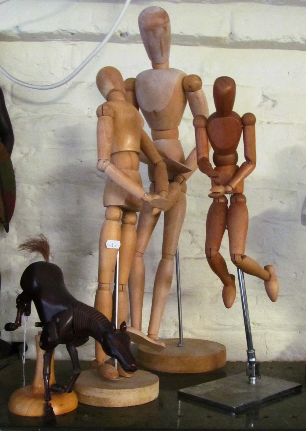 Three artist's treen models and an artist's horse model