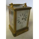 A brass carriage clock with alarm dial and repeat (strike and repeat not working) alarm working