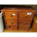A small pine chest of six drawers