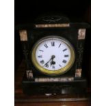 A Victorian black slate and marble mantel clock with eight day movement