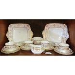 A Wedgwood gilt and floral four place setting teaset with two bread and butter plates, milk jug