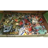 A suitcase full of plastic military figures and vehicles et cetera
