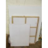 Various large blank artists canvases