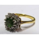 An 18ct gold green stone and diamond ring 3.3g Size L