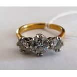 A three stone diamond ring on 18ct gold band central stone approx 1ct size N/O