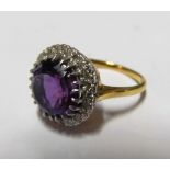 An 18ct gold amethyst and diamond cluster ring 4.6g Size L