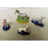 A group of Staffordshire including zebra and cottage (s/a/f)