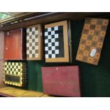 Six travelling chess sets