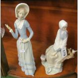 A Lladro lady (missing parasol) and lady seated with bird