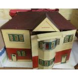 A vintage dolls house and furniture