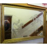 A gilt bevelled mirror with etched scene of man on horseback 40” x 28”