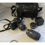 A Nikon F70 camera with Nikon lense and Tamron lense (i.c)