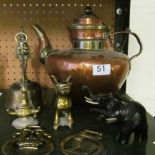 A brass winged lion ornament, an eastern copper jug and other brass etc