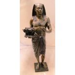 A bronze of an Egyptian figure holding sacred cow on plinth base 28" high