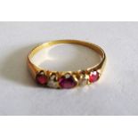 A ruby and diamond small ring and three other rings (one central stone loose)