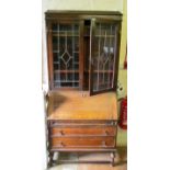 An oak bureau bookcase