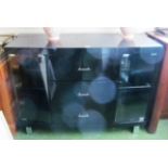 A modern black glass sideboard with chrome fittings 47”w