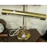 A brass desk light