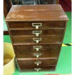 A small filing chest seven drawers 25”h x 11.5”w