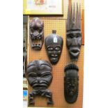A 'Royal' Effigy face mask from Benin South Nigeria and four other masks