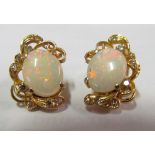A pair of 585 earrings set opal and small diamonds