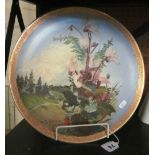 A large hand painted floral plate signed L James