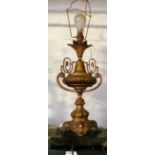 A lamp in the form of a gilt urn shaped vase on marble base