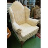 A semi-wing armchair on carved cabriole legs