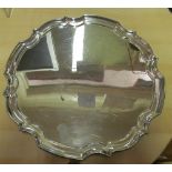 A silver salver with pie crust edge on scroll feet 12” diameter 29 ozs