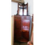 A small mahogany corner cupboard with rosewood top