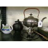 A silver-plate spirit kettle on stand and two teapots