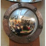 A beaten silvered framed convex mirror 18.5”