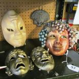 A pottery Bacchus face mask, pair of brass greek style masks and two others