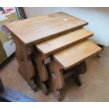 A nest of three oak occasional tables