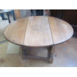 A small oak dropleaf table and a two tier table