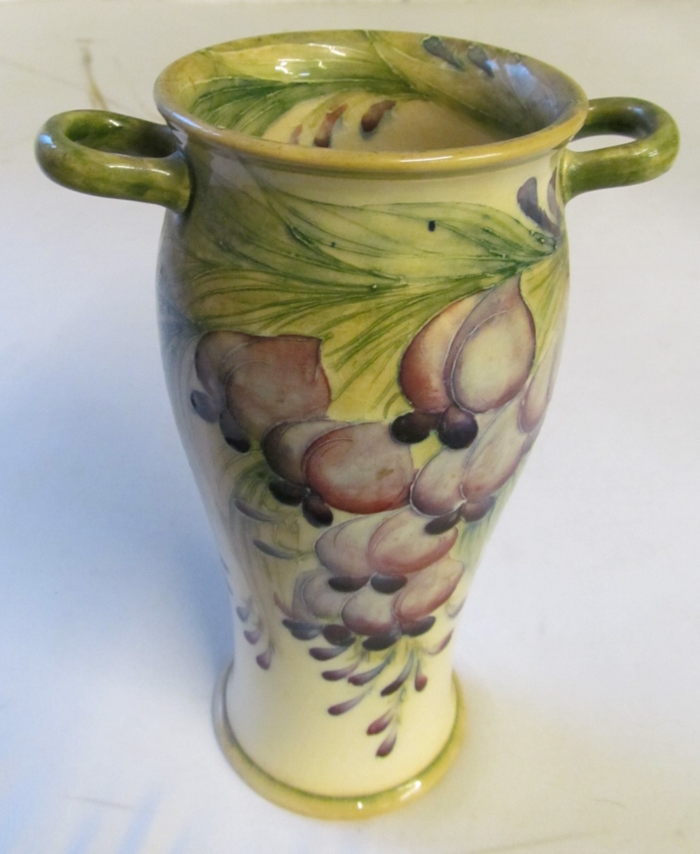 A William Moorcroft for James McIntyre ‘Wisteria’ pattern twin handled baluster shaped vase,
