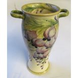 A William Moorcroft for James McIntyre ‘Wisteria’ pattern twin handled baluster shaped vase,